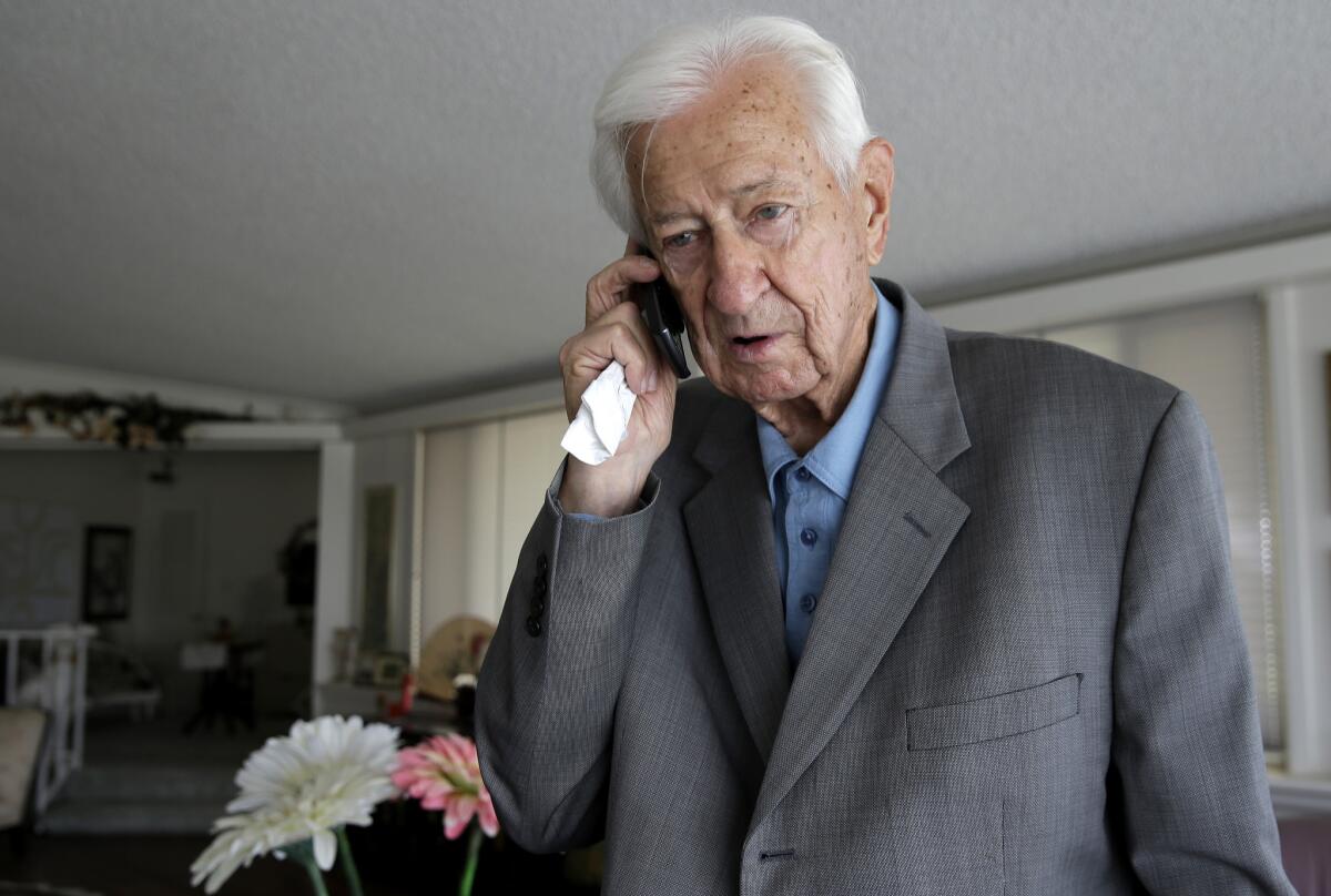 Rep. Ralph Hall speaks on his cellphone at his home in Rockwall, Texas.