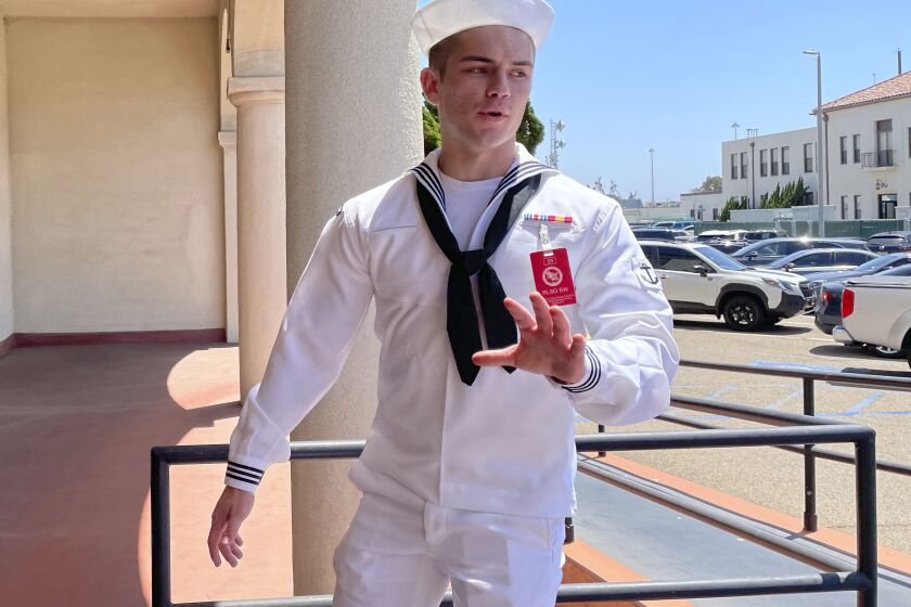FILE - US Navy sailor Ryan Sawyer Mays walks past reporters at Naval Base San Diego before entering a Navy courtroom, Aug. 17, 2022, in San Diego. No one disputes that the Navy shares blame for the loss of the USS Bonhomme Richard, the $1.2 billion amphibious assault ship that was consumed by flames in San Diego in July 2020 as officers failed to respond quickly and its crew struggled with broken equipment. But none of that would not have happened, according to prosecution closing arguments, Thursday, Sept. 29, 2022, without Ryan Sawyer Mays. (AP Photo/Julie Watson, File)
