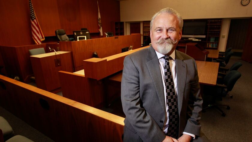 Superior Court Judge David Danielsen, who is retiring, in the courtroom where he served as presiding judge in downtown San Diego.