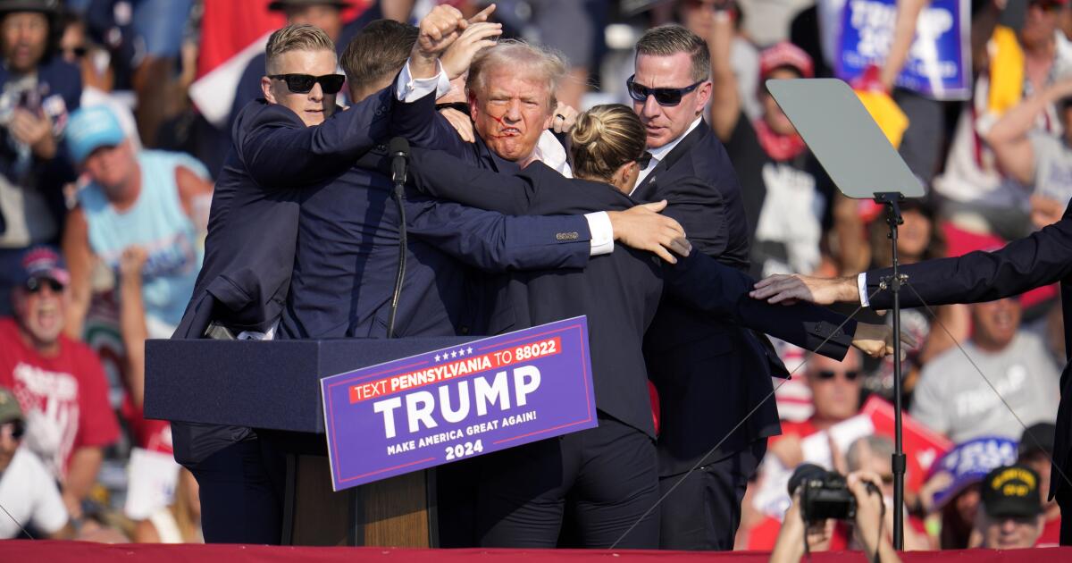 Trump taking pictures a historic second echoing previous political violence