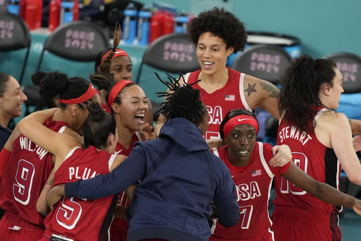 U.S. women's basketball players celebrate their 67-66 victory over France for the gold medal at the Paris Olympic Games.