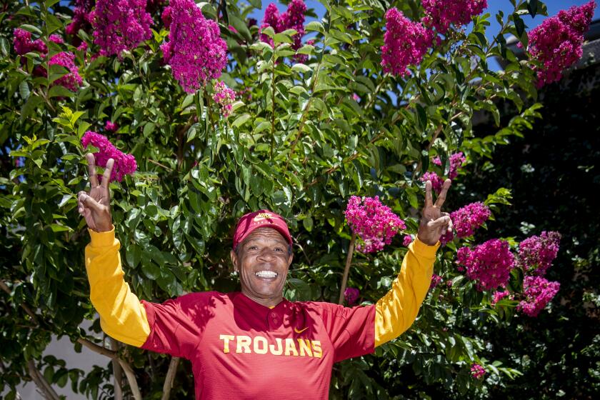Aliso Viejo, CA - June 29: USC Heisman winner Charles White shows his Trojan spirit but is suffering from level 2 dementia and living in a memory care center, where he always wears USC gear. He struggles to keep up with in-depth conversations. His family has provided his care after he fell on hard times and has had no contact from the university in recent years. Photo taken in Belmont Village Senior Living home, Aliso Viejo Wednesday, June 29, 2022. (Allen J. Schaben / Los Angeles Times)