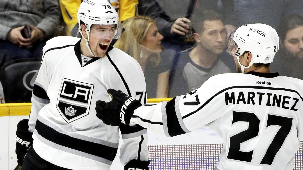 Kings left wing Tanner Pearson celebrates his overtime goal against the Predators with defenseman Alec Martinez on Saturday night in Nashville.