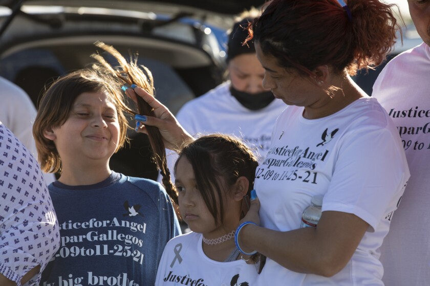 Azucena Gallegos with her children Gabriel and Brianna during what would've been her eldest child's 13th birthday.