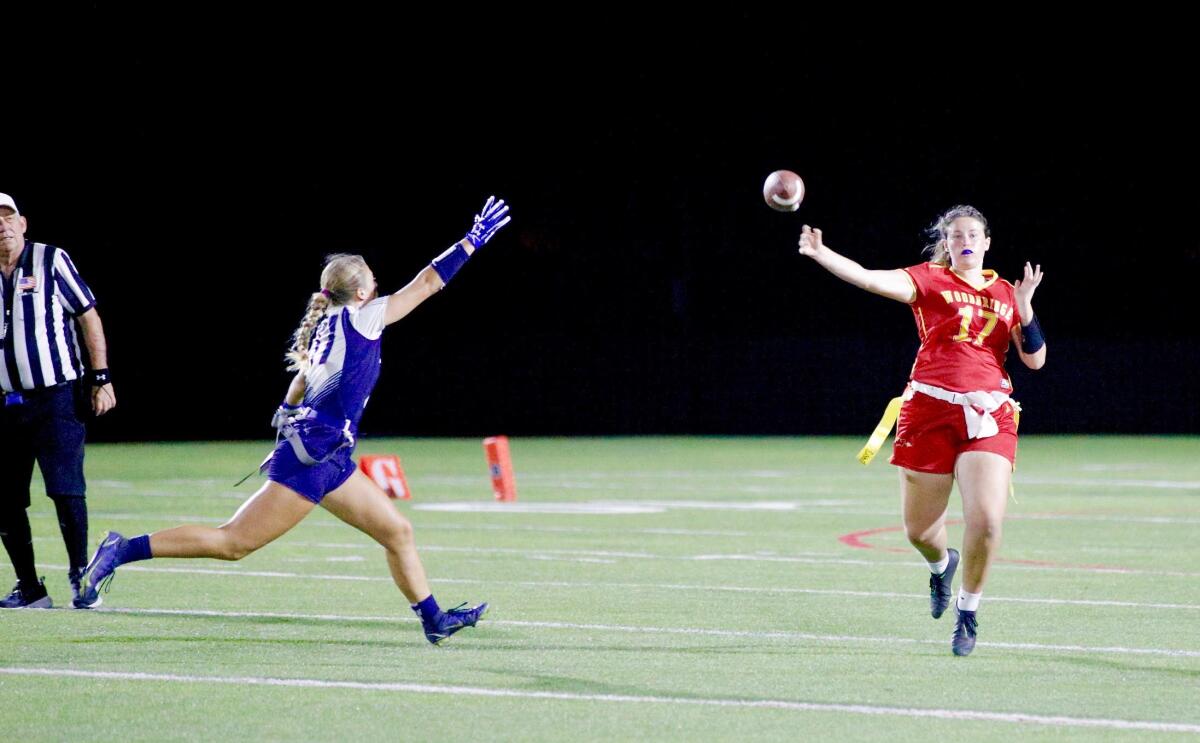 Teagan Burrus and Payton Williams during a flag football game.