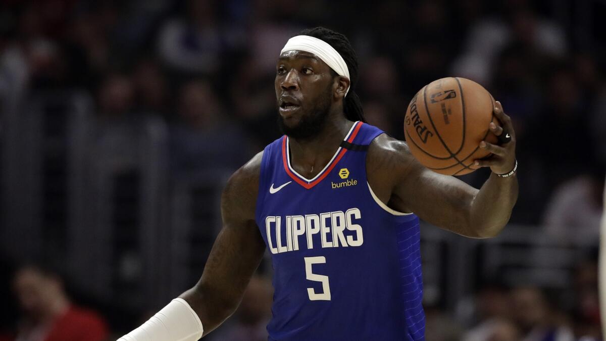 Clippers forward Montrezl Harrell controls the ball during a game.