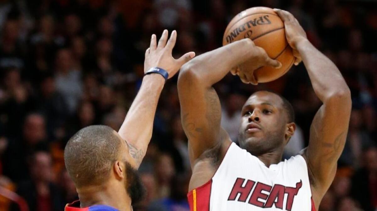 Heat guard Dion Waiters shoots over Pistons forward Marcus Morris during a game on Jan. 28.