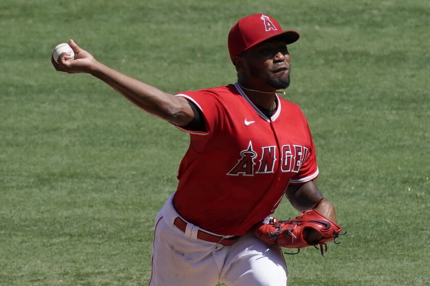 Los Angeles Angels starting pitcher Julio Teheran throws to the Texas Rangers.