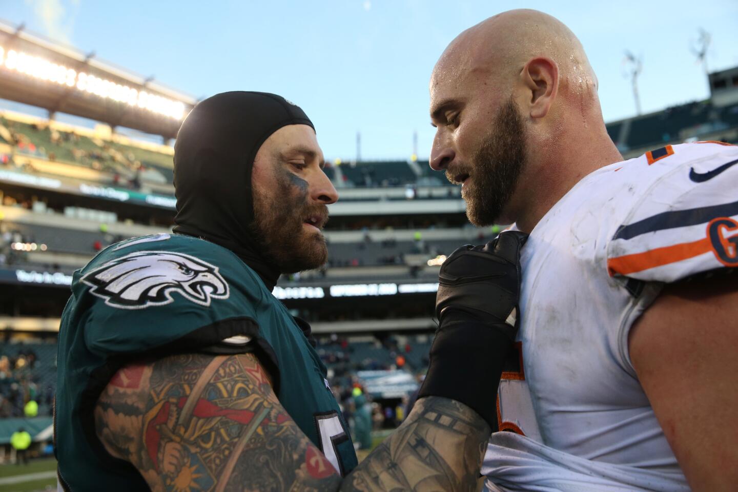 Eagles defensive end Chris Long, left, talks to his brother, Bears offensive guard Kyle Long, after an Eagles 31-3 win at Lincoln Financial Field in Philadelphia on Sunday, Nov. 26, 2017.