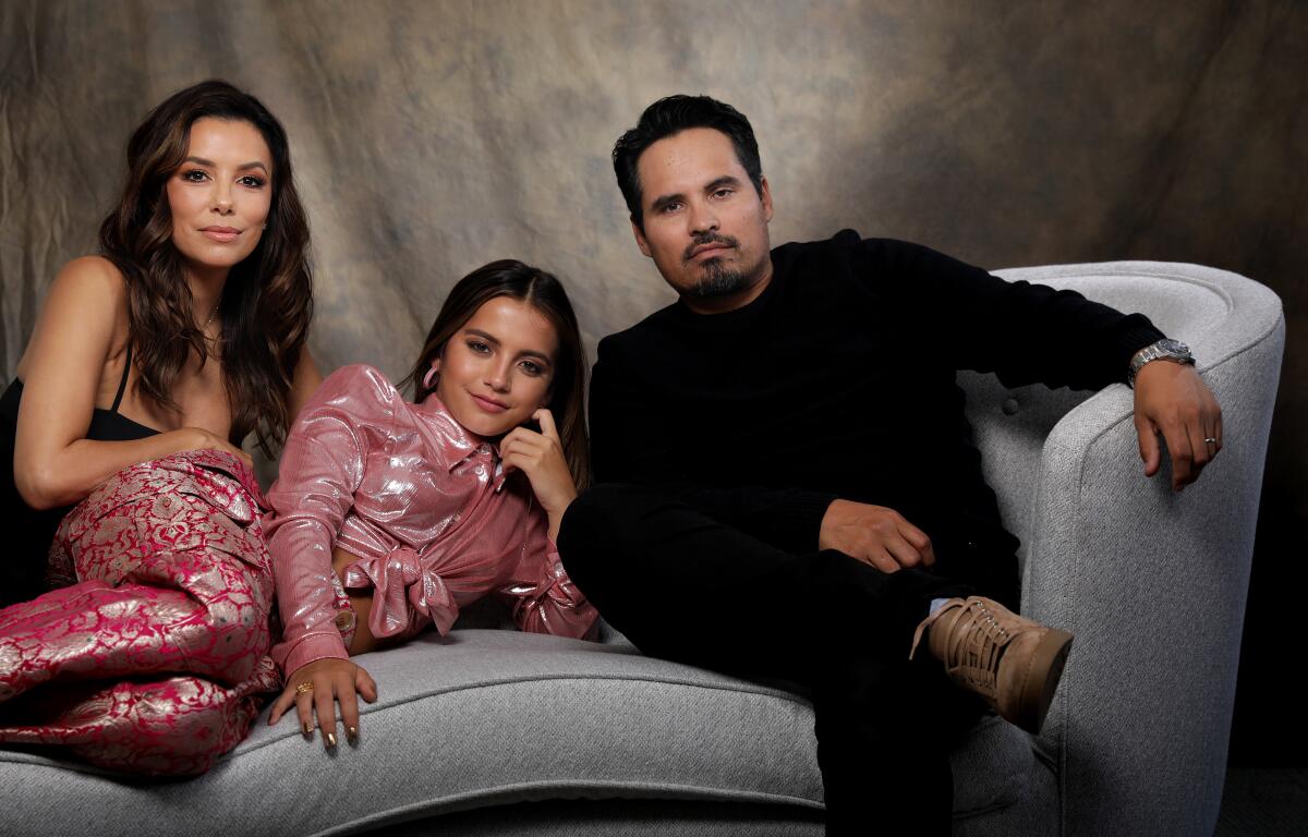 From left, Eva Longoria, Isabela Moner and Michael Pe?a star in “Dora and the Lost City of Gold," a live-action adaptation of Nickelodeon's beloved "Dora the Explorer" cartoon.