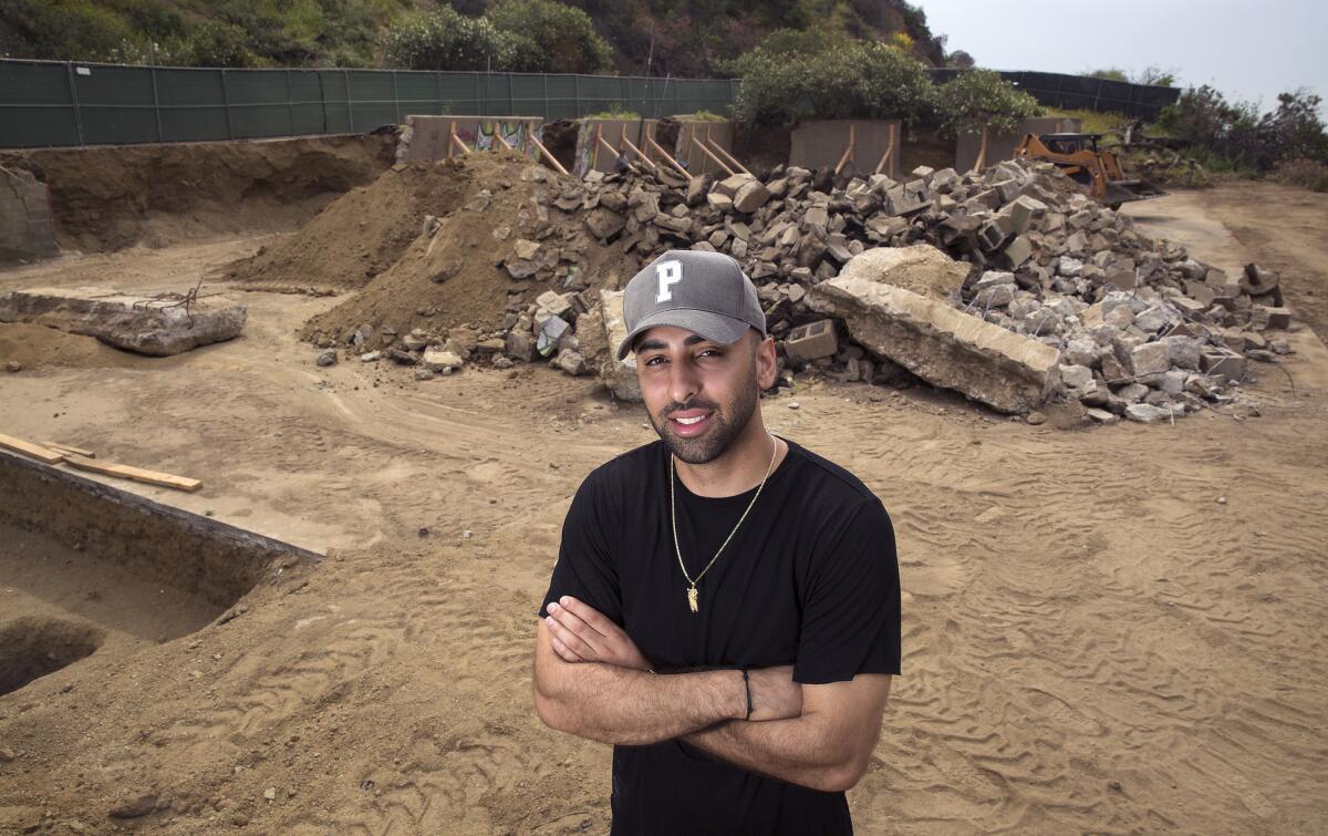 Neima Khaila stands on the site of a basketball court under construction in Runyon Canyon Park.