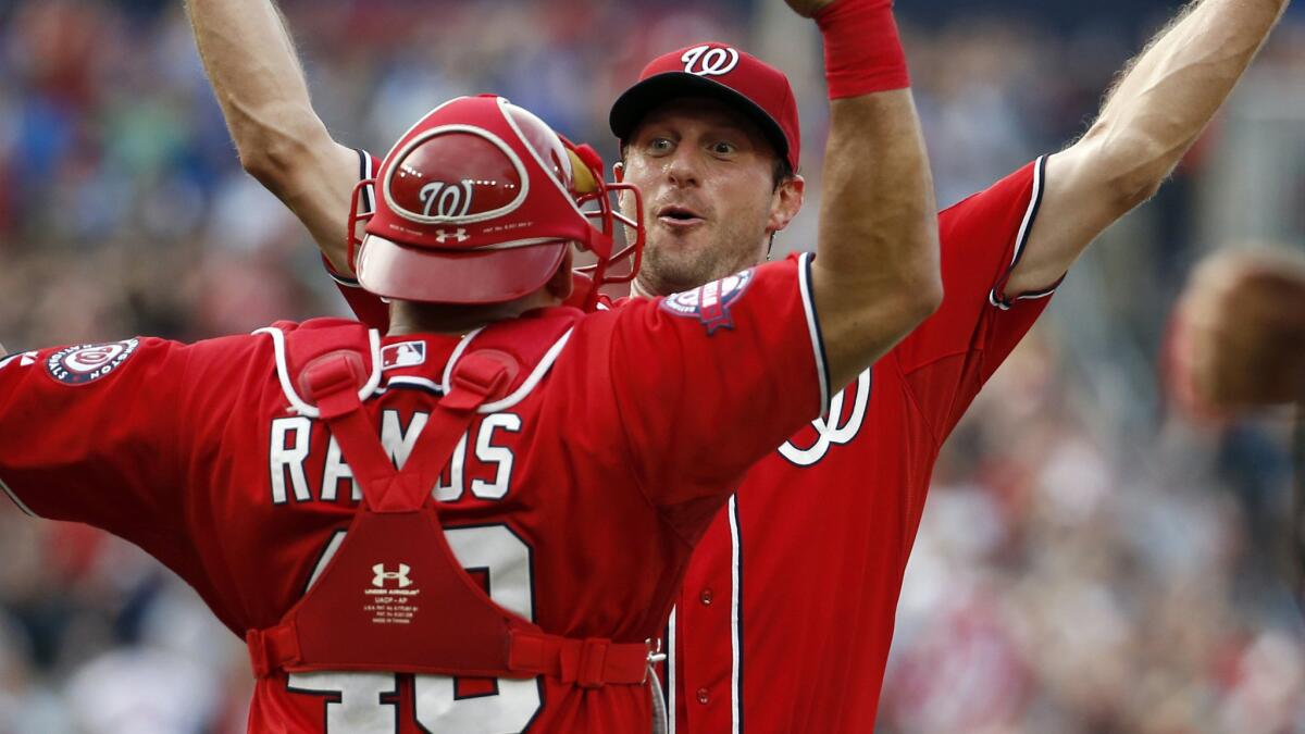 Washington Nationals starter Max Scherzer, right, celebrates with catcher Wilson Ramos after throwing a no-hitter in a 6-0 victory over the Pittsburgh Pirates on Saturday.