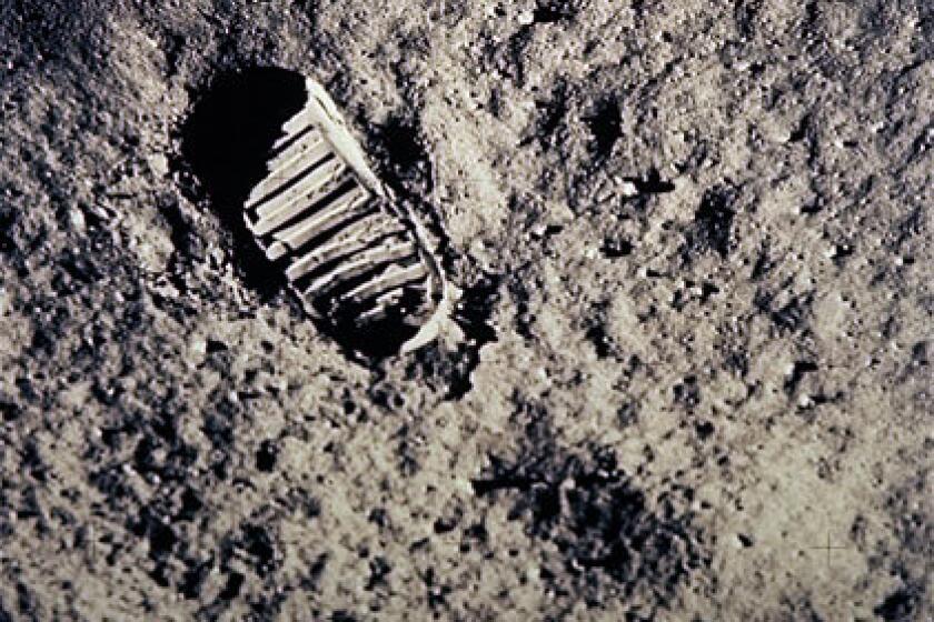 A footprint is left on the lunar surface after Neil Armstrong and Buzz Aldrin became the first men to walk on the moon. The mission fulfilled President Kennedy's 1961 mandate to land a man on the moon by the end of the 1960s.