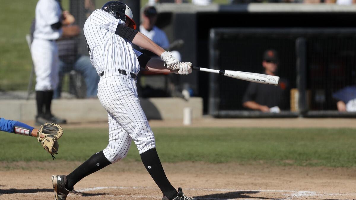 Huntington Beach High's Cole DiMarco, shown against Fountain Valley on April 12, hit a home run for the Oilers on Thursday to help them clinch a share of the Surf League title.