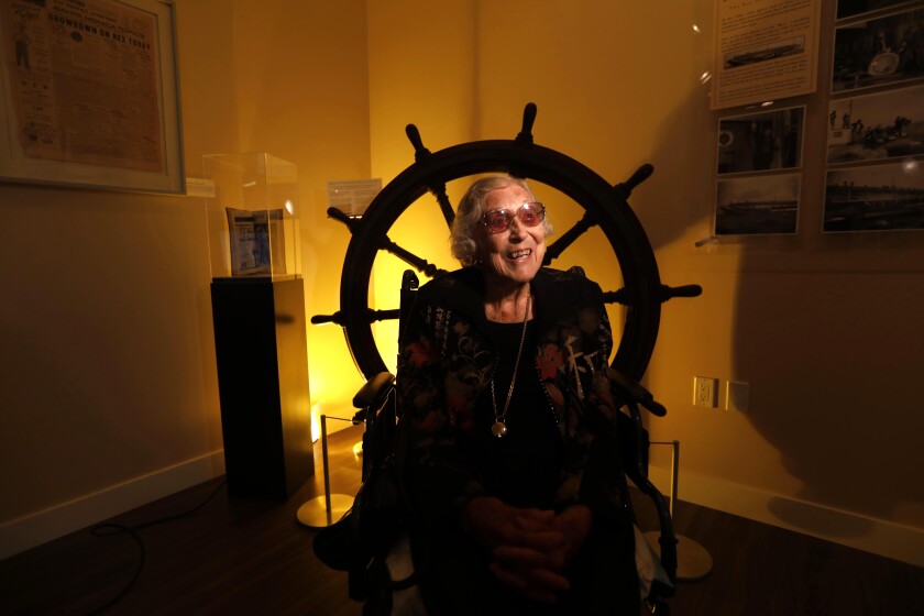 Florence Kinney, 107, sits in front of the steering wheel that once piloted the S.S. Rex.