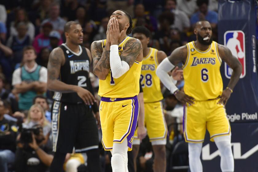Los Angeles Lakers guard D'Angelo Russell (1) reacts during the second half of Game 2 in a first-round NBA basketball playoff series against the Memphis Grizzlies Wednesday, April 19, 2023, in Memphis, Tenn. (AP Photo/Brandon Dill)