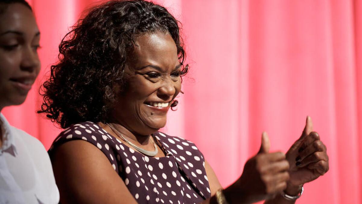 L.A.schools Supt. Michelle King gives a thumbs-up to cheer an audience of school district employees and a best-yet graduation rate.