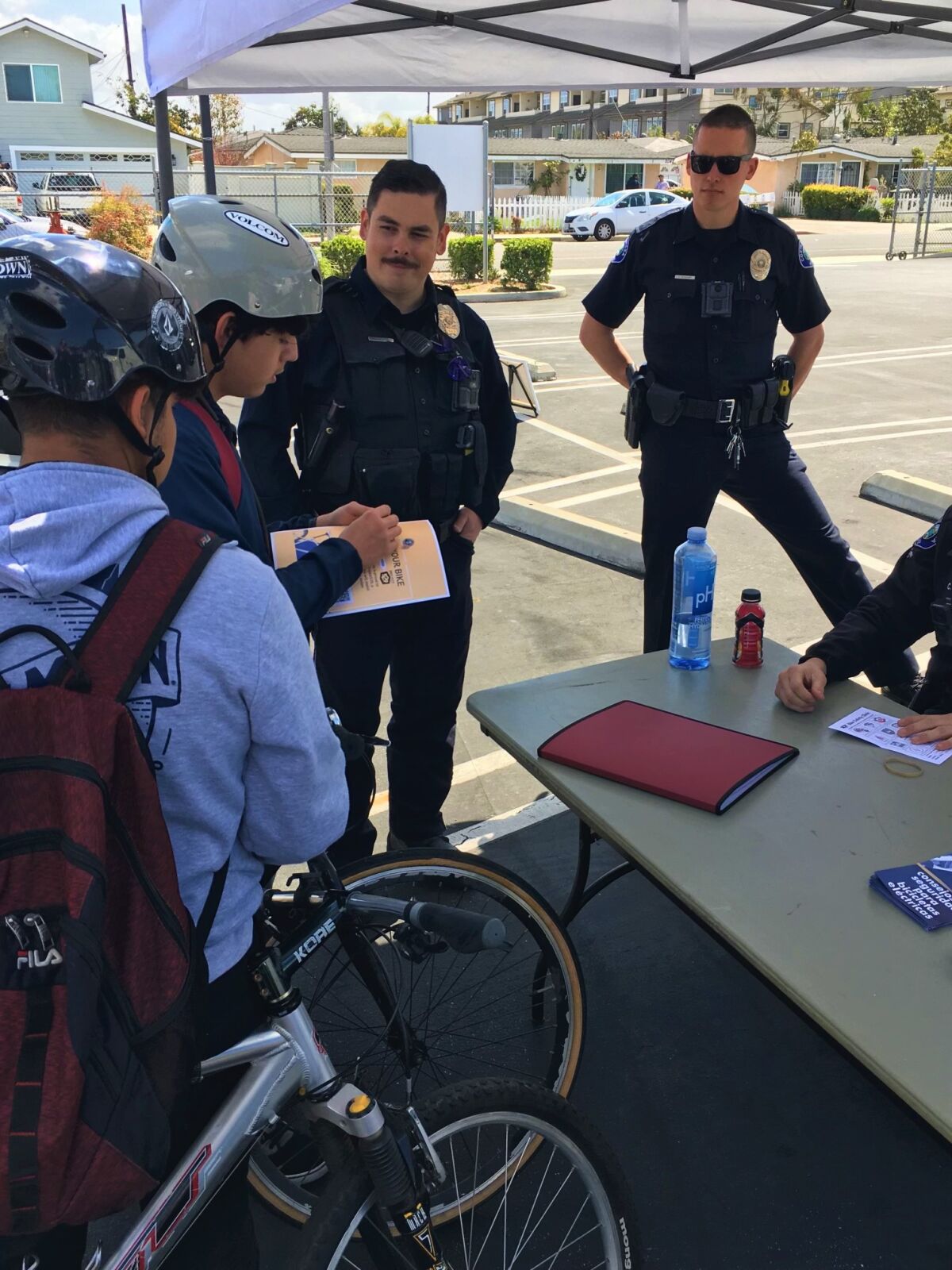 CMPD officers at a local bicycle safety event Saturday helped residents register their bikes online through Project 529.