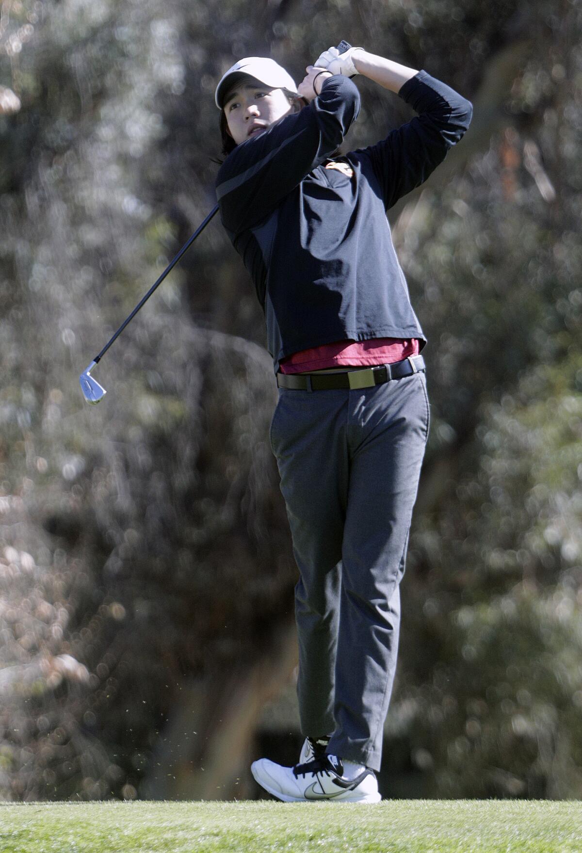 GCC's Justin Del Rosario tees off on the sixteenth in the Glendale College Invitational at Oakmont Country Club in Glendale on Monday, February 10, 2020. The wind was a factor that changed the game for all the community college teams making scores much higher.