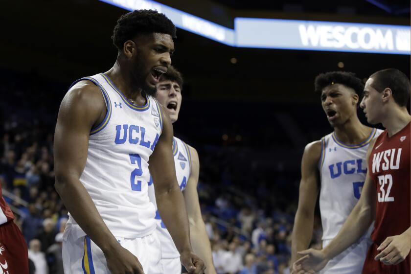 UCLA forward Cody Riley (2) celebrates after blocking a shot during overtime of an NCAA college basketball game against Washington State, Thursday, Feb. 13, 2020, in Los Angeles. (AP Photo/Marcio Jose Sanchez)