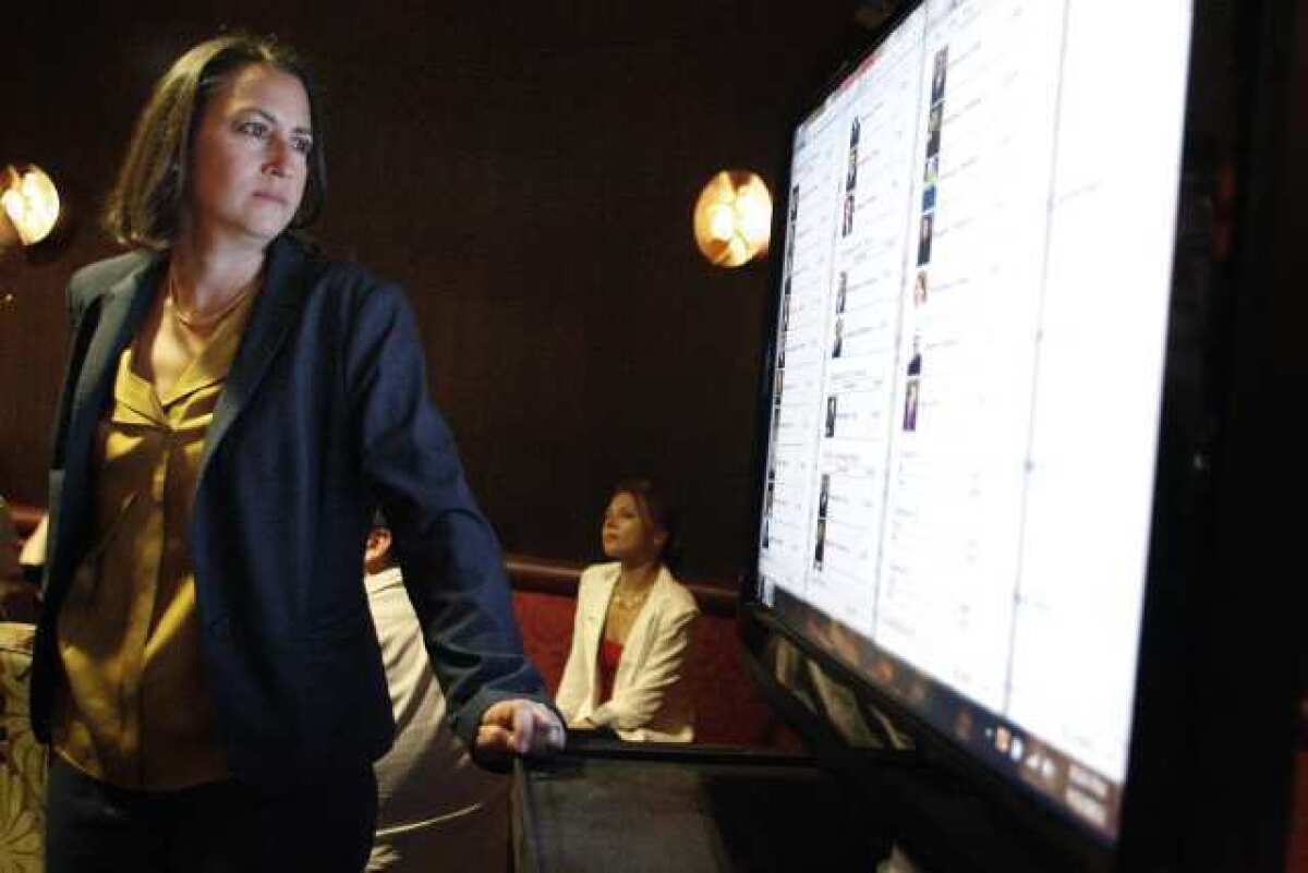 City Councilwoman Laura Friedman watches the results on a screen during election night.