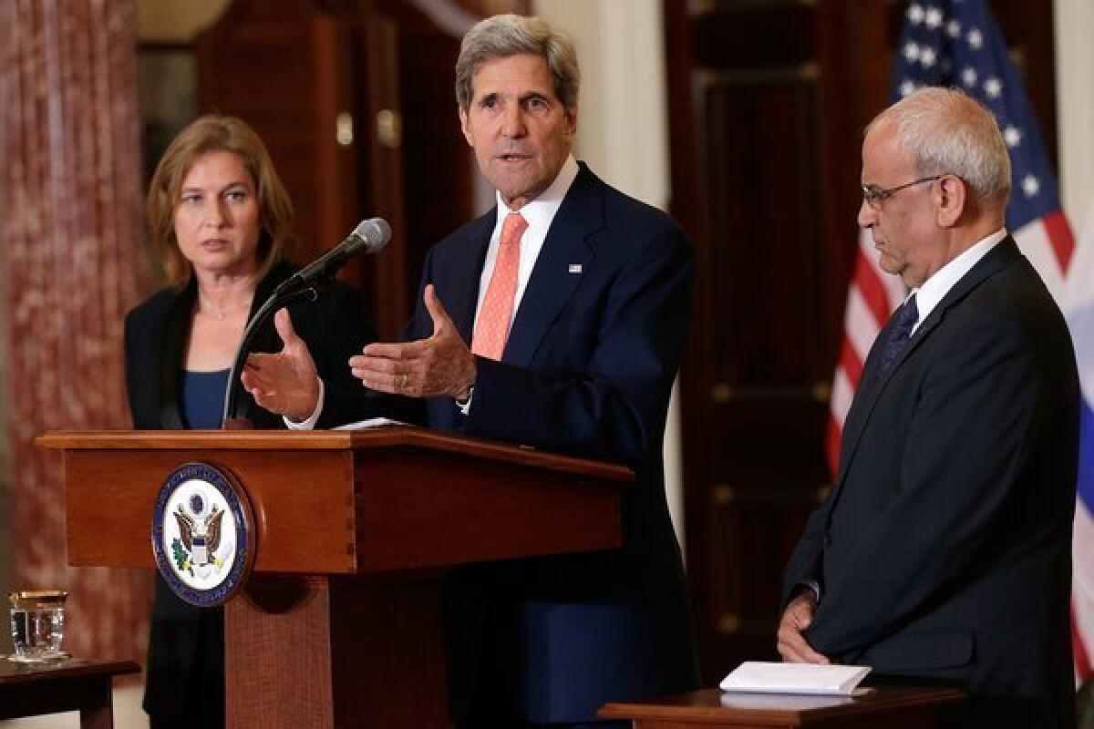 Secretary of State John F. Kerry, flanked by Israeli Justice Minister Tzipi Livni, left, and Palestinian chief negotiator Saeb Erekat, discusses the Middle East peace talks at a news conference in Washington.