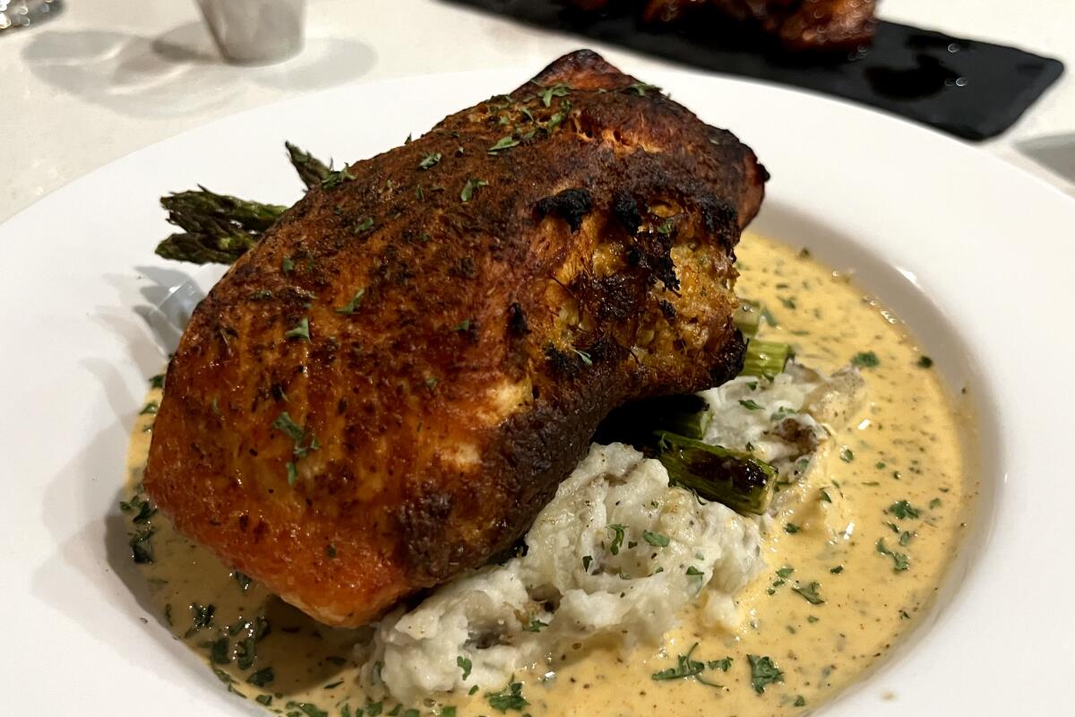 Crab-stuffed salmon over garlic mashed potatoes from 1010 Wine