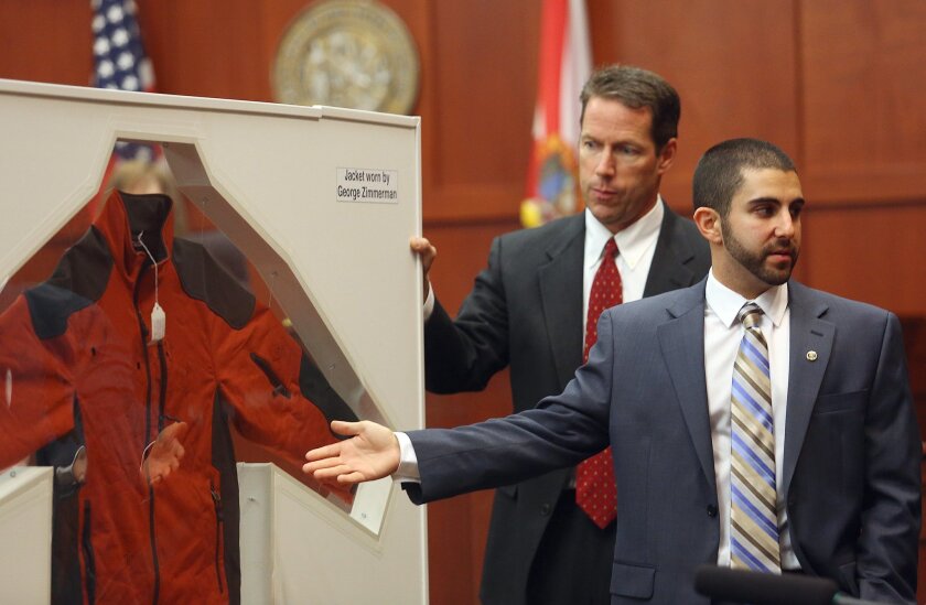 Crime Lab Analyst Anthony Gorgone points to a jacket worn by George Zimmerman on the night Zimmerman shot Trayvon Martin during the George Zimmerman trial in Sanford, Fla., on Wednesday.