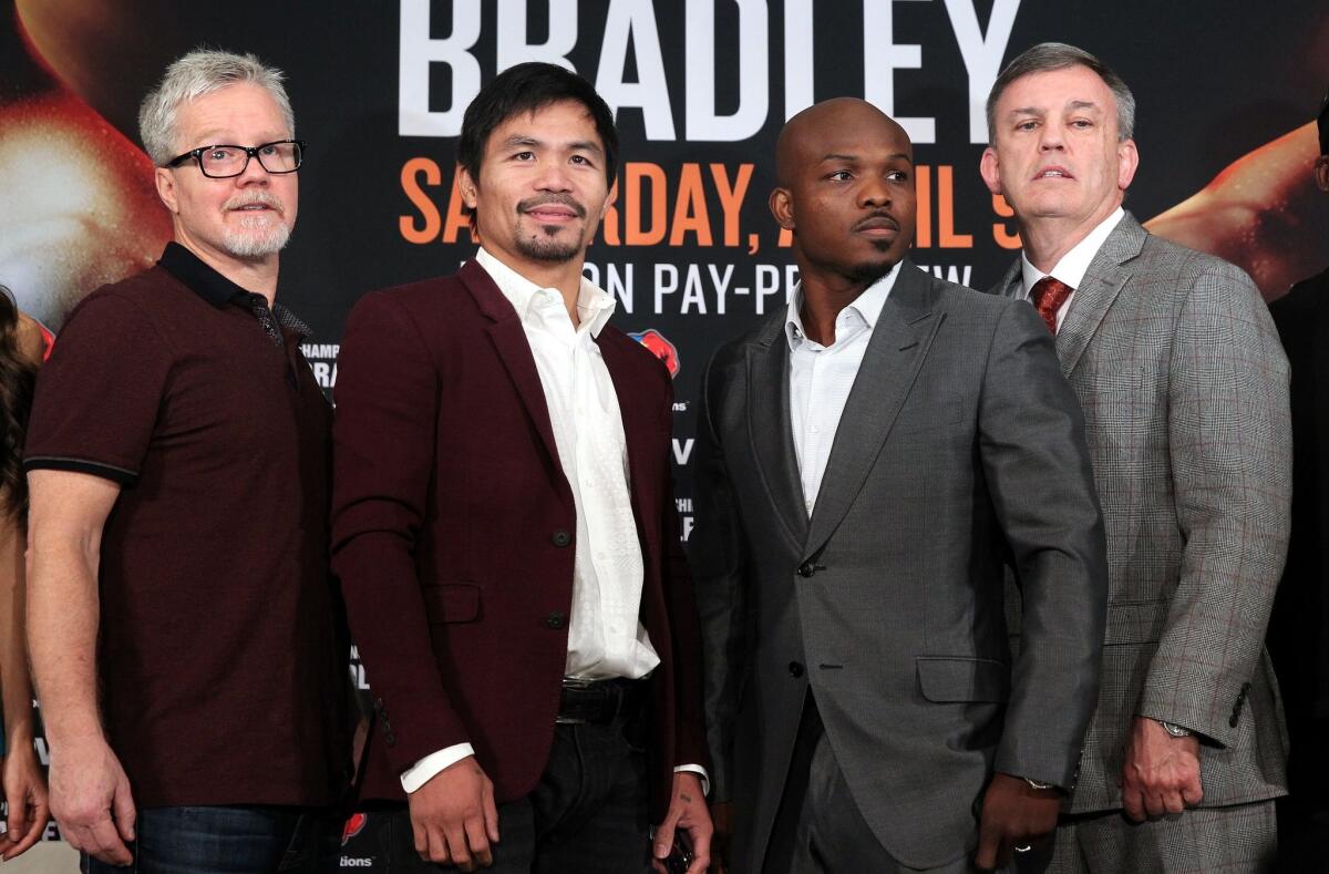 Freddie Roach, left, Manny Pacquiao, Timothy Bradley and trainer Teddy Atlas gather at a January news conference announcing the third Pacquiao-Bradley fight.