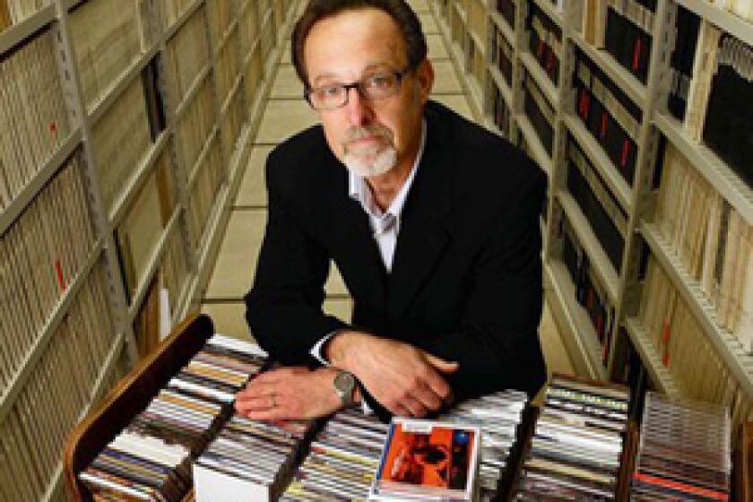 RECORD COLLECTION: Gene DeAnna displays some of the Library of Congress' musical holdings.