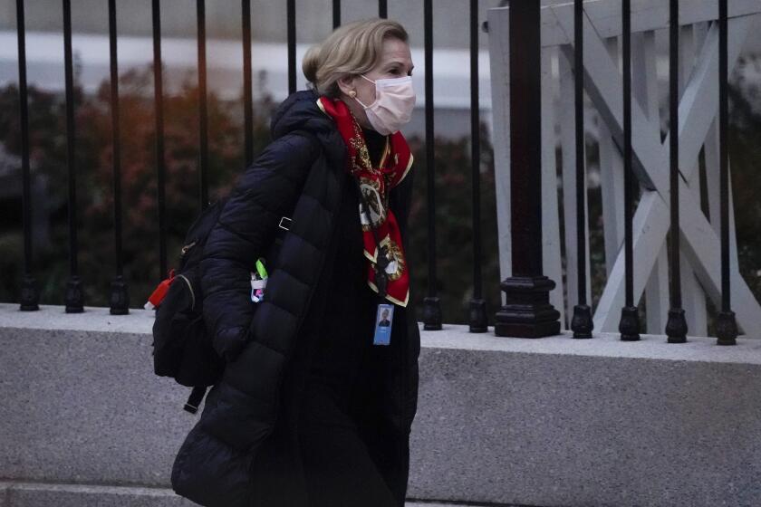 Dr. Deborah Birx, White House coronavirus response coordinator, leaves the White House Tuesday, Dec. 1, 2020, in Washington. (AP Photo/Evan Vucci)