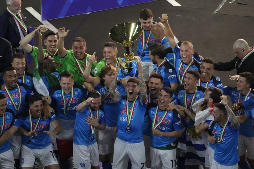 Napoli's players celebrate after winning the Serie A soccer title trophy at the Diego Maradona Stadium, in Naples, Sunday, June 4, 2023. (AP Photo/Andrew Medichini)