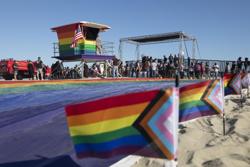 LONG BEACH, CA - JUNE 10: A new rainbow-colored lifeguard tower was unveiled at Long Beach to replace the one that was burned down in March. The tower serves as a symbol of LGBTQ+ pride. Photographed on Thursday, June 10, 2021 in Long Beach, CA. (Myung J. Chun / Los Angeles Times)