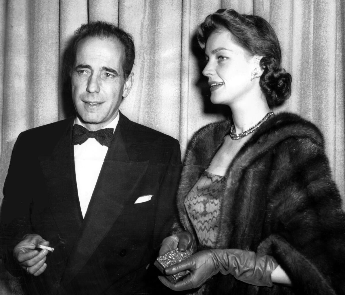 Lauren Bacall and Humphrey Bogart arrive for Academy Awards ceremonies in Los Angeles on March 20, 1952.