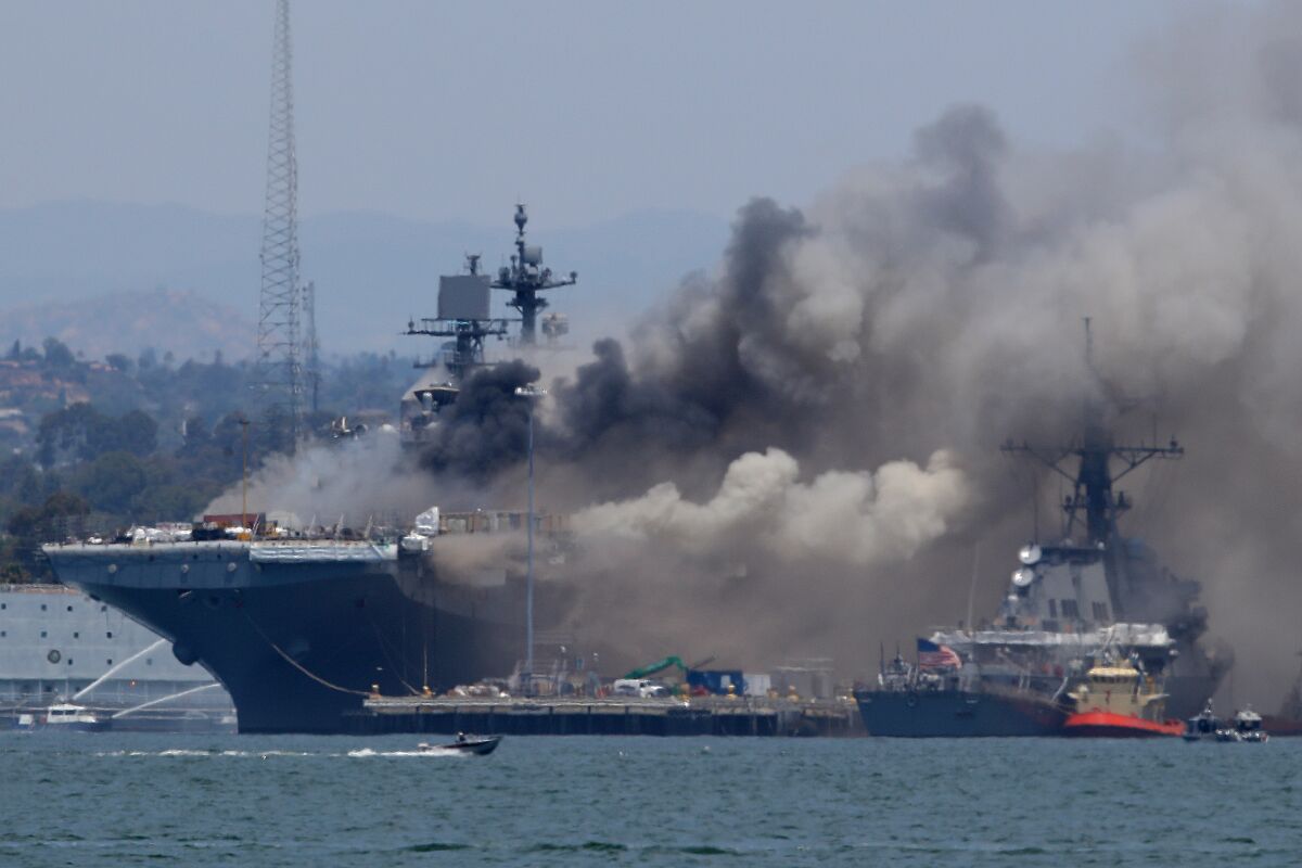 A fire burns on the amphibious assault ship Bonhomme Richard at Naval Base San Diego on July 12, 2020 