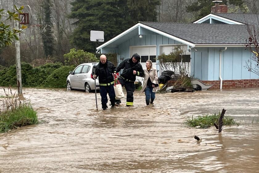 Recent flooding in the Arcata area. The two firefighters pictured doing the rescue are Fire Captain Alex Manousos (left) and Fire Captain Evan Gibbs (right).)