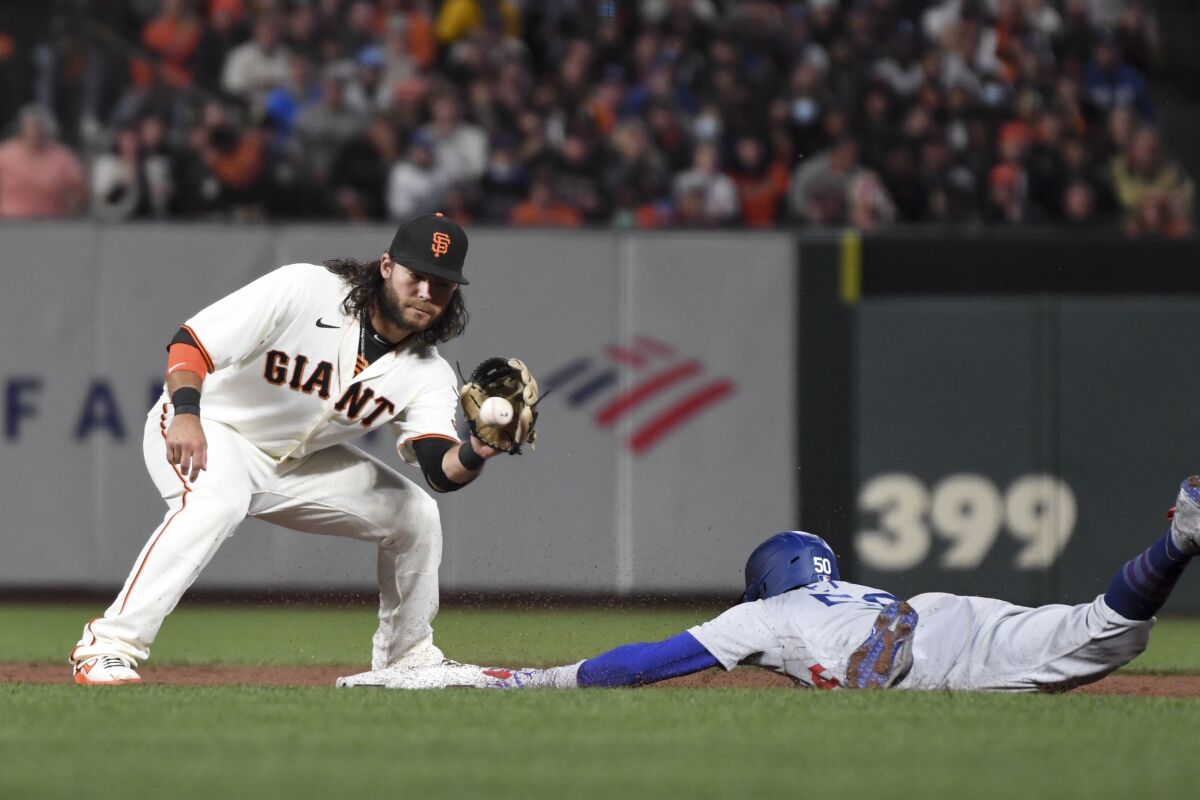 Mookie Betts steals second base ahead of the tag by San Francisco Giants shortstop Brandon Crawford during the sixth inning.
