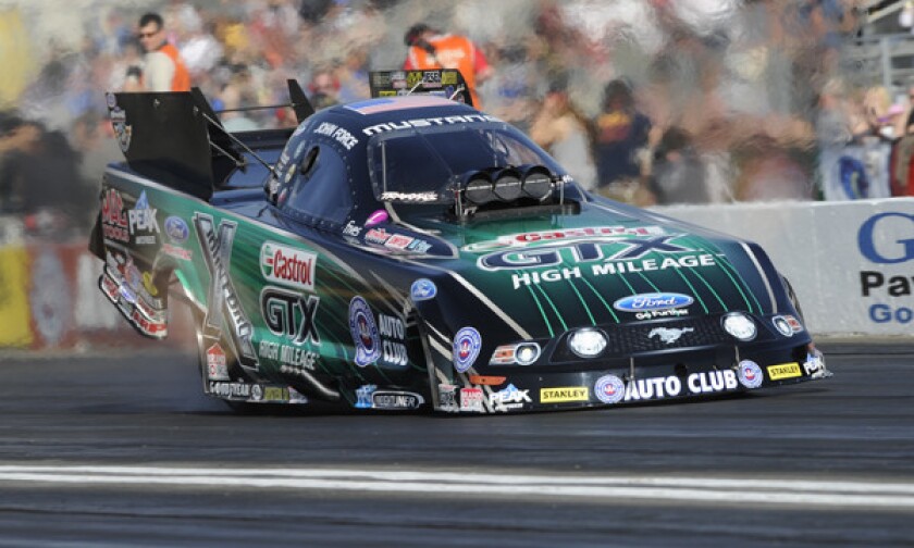 NHRA drag racing legend John Force competes in qualifying at the NHRA Winternationals in Pomona on Saturday.