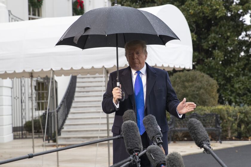 President Donald Trump speaks with reporters on the South Lawn of the White House before departing, Monday, Dec. 2, 2019, in Washington. (AP Photo/Alex Brandon)