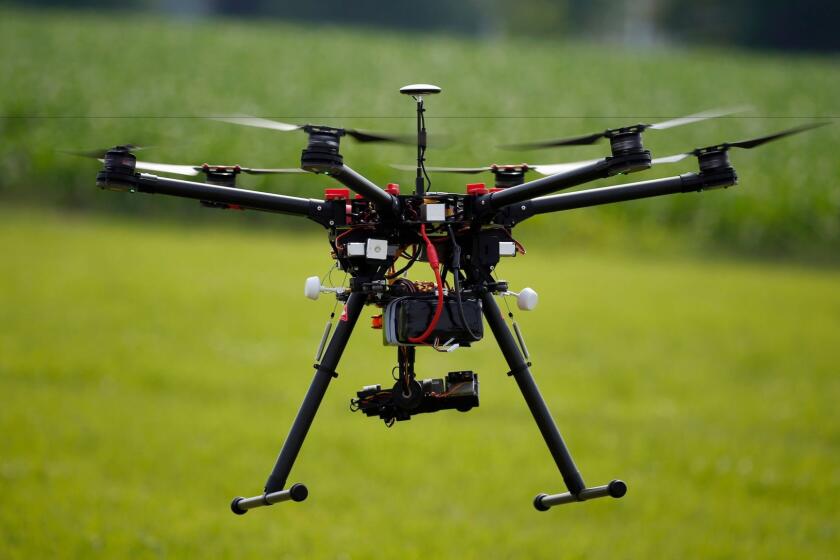 A hexacopter drone is flown during a demonstration for board members of the National Corn Growers Assn. in Cordova, Md., in 2015.