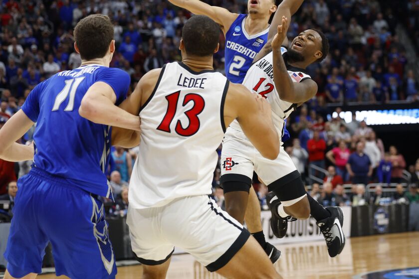 Louisville, KY - March 26: San Diego State's Darrion Trammell is fouled by Creighton's Ryan Nembhard to set up game-winning free throw in a 57-56 victory in an Elite 8 game in the NCAA Tournament on Sunday, March 26, 2023 in Louisville, KY. (K.C. Alfred / The San Diego Union-Tribune)