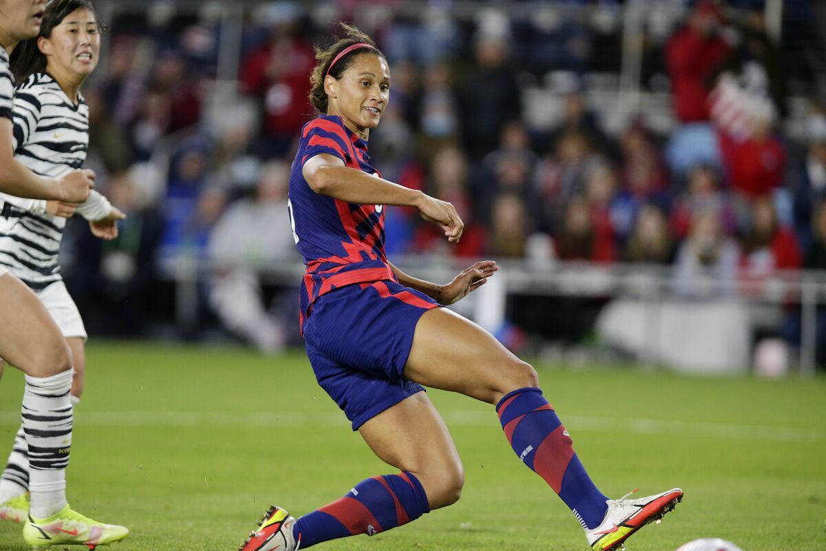 U.S. forward Lynn Williams (6) scores as South Korea's Hyojoo Choo trails her
