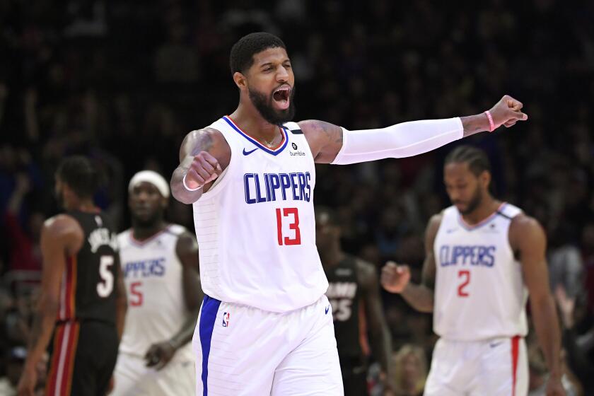 Los Angeles Clippers guard Paul George celebrates after the Clippers made a 3-point basket during the second half of the team's NBA basketball game against the Miami Heat on Wednesday, Feb. 5, 2020, in Los Angeles. The Clippers won 128-111. (AP Photo/Mark J. Terrill)