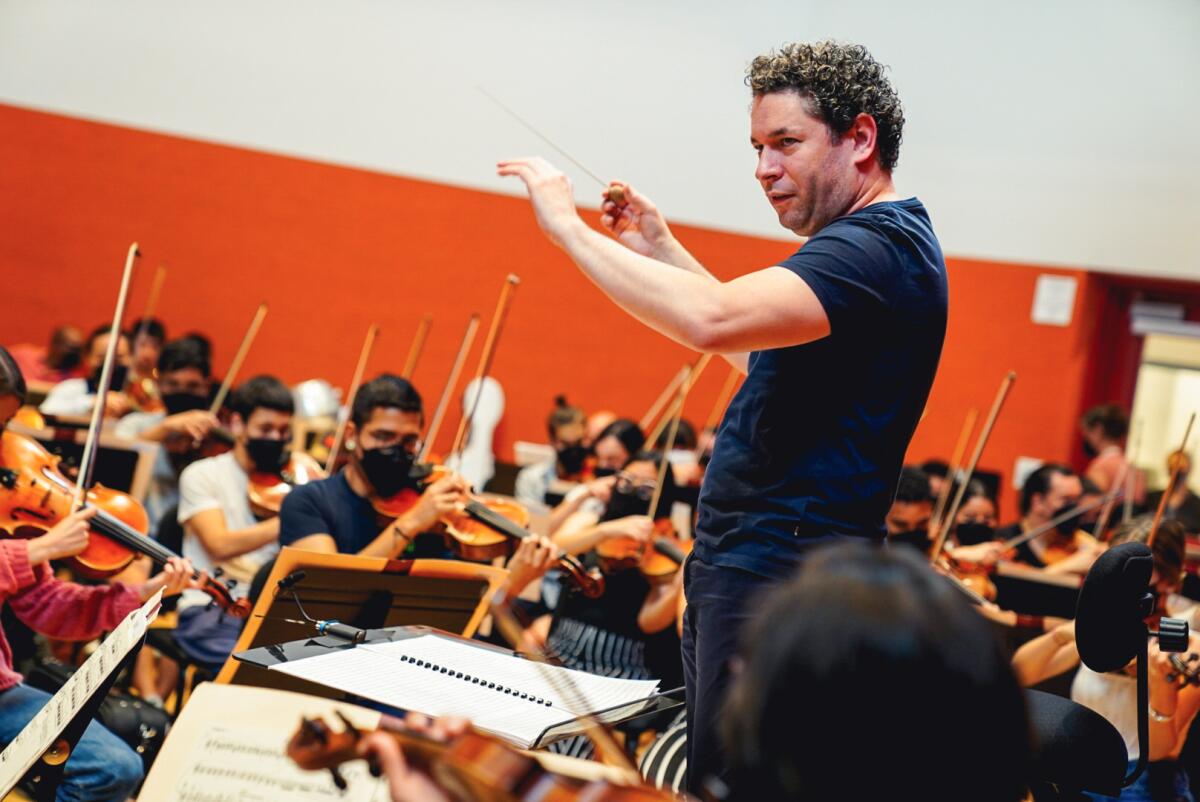 A conductor leads an orchestra.
