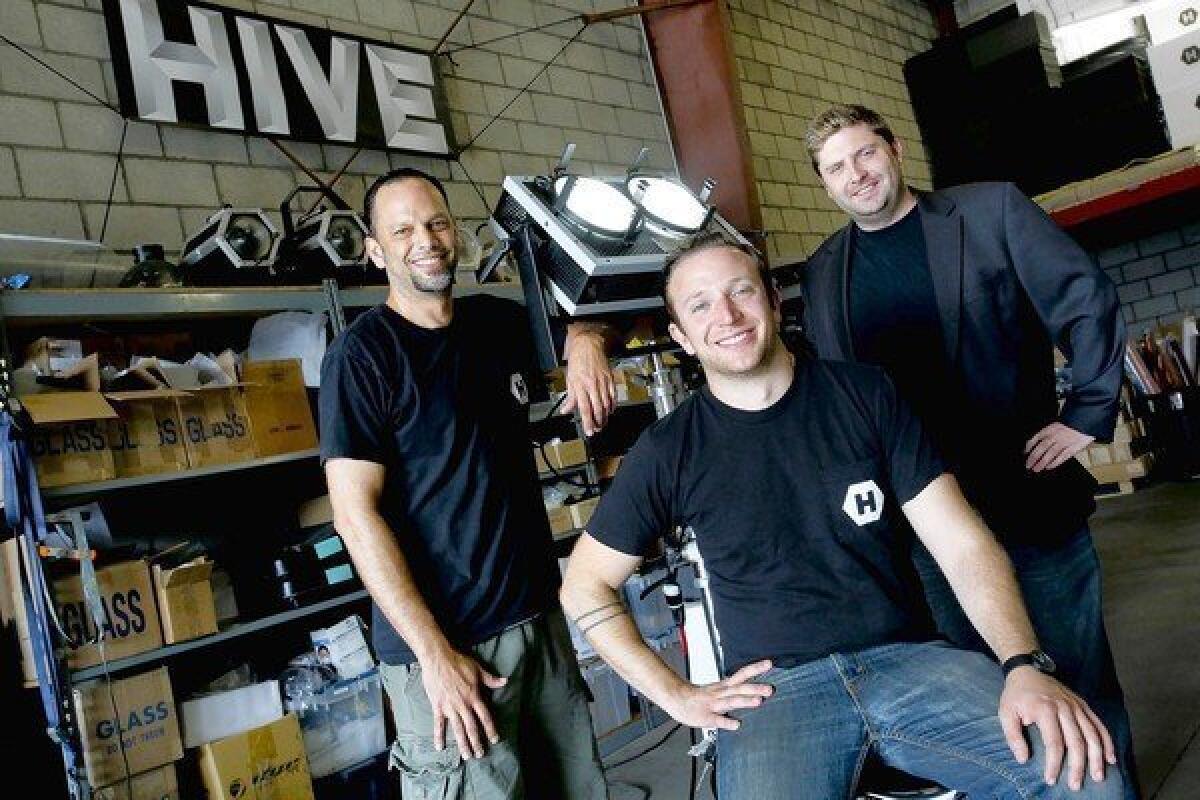 Hive Lighting partners Jaime Emmanuelli, left, Jonathan Miller and Rob Rutherford at their garage work space in downtown Los Angeles.