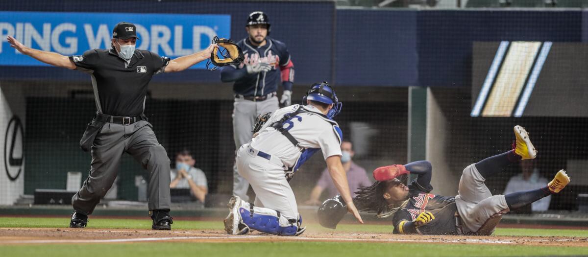 Atlanta Braves right fielder Ronald Acuna Jr. (13) is safe at home 