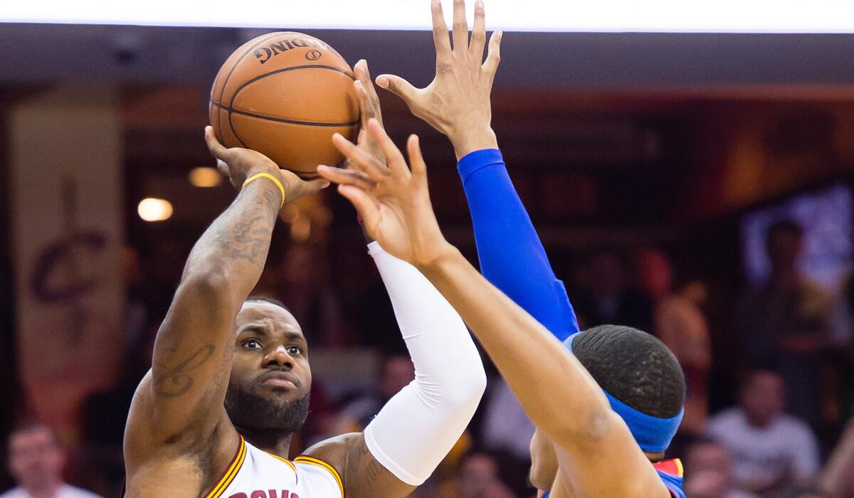 Cleveland Cavaliers' LeBron James shoots over Detroit Pistons' Tobias Harris during the first half of the NBA Eastern Conference first round on Wednesday.