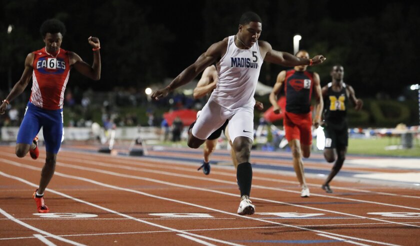 Madison's Kenan Christon wins the 200-meter sprint at the state championships.