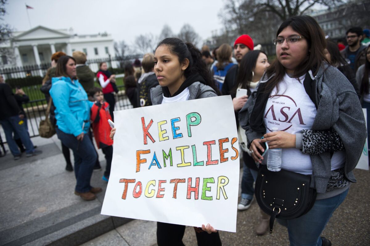Immigrant rights activists protest in front of the White House in December ahead of deportation sweeps.