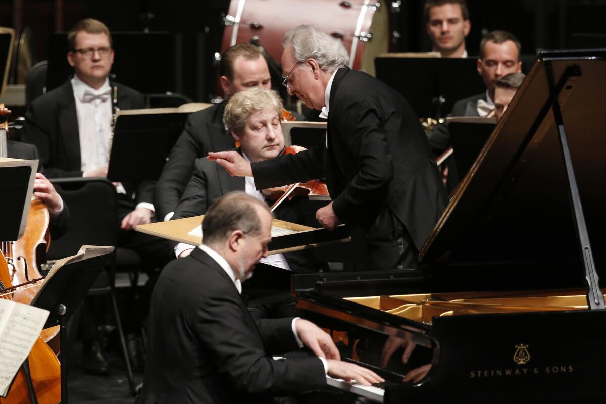 Yuri Temirkanov conducts the St. Petersburg Philharmonic with piano soloist Garrick Ohlsson. (Gary Coronado / Los Angeles Times)